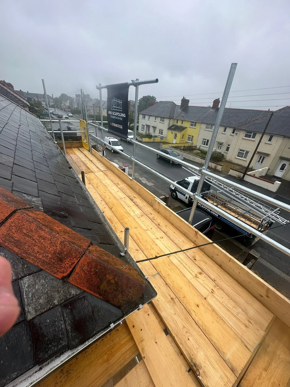 View along a boarded scaffold working platform